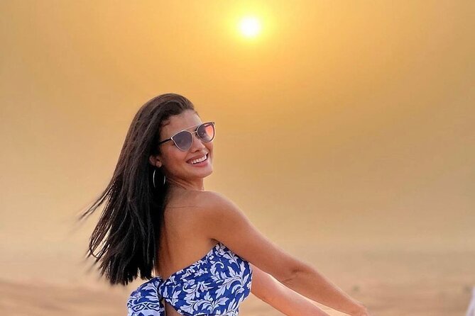 Dubai Desert Safari With Dinner And Live Shows - Sandboarding and the sunset stop