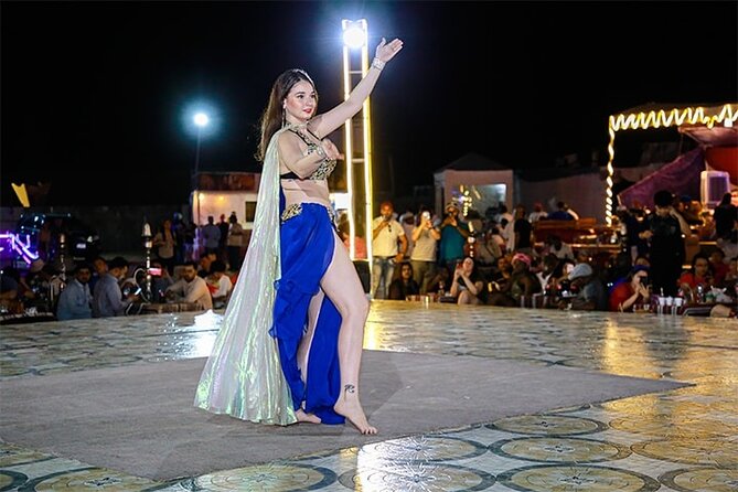Dubai Desert Safari with Dinner, Camel Ride & Dune Bashing - Belly dancing, tanoura, and fire on stage