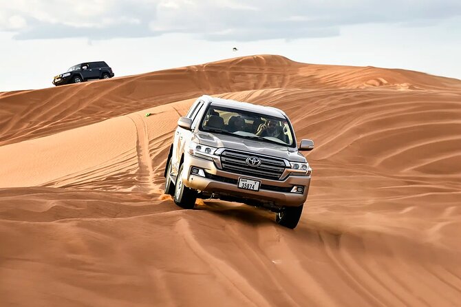 Dubai Desert Safari with Dune Bashing & Live Shows - Arabic coffee, dates, and camp arrival