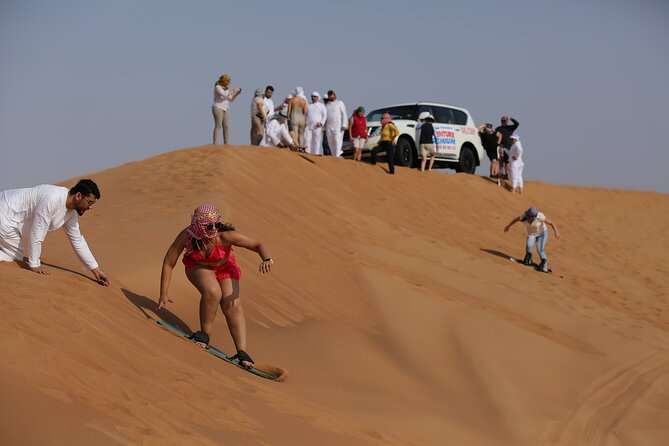 Dubai Desert Safari with Quad Bike, Dune Bashing, Camel Ride, Sand Boarding &BBQ - Falcon photos and the first important inclusion check