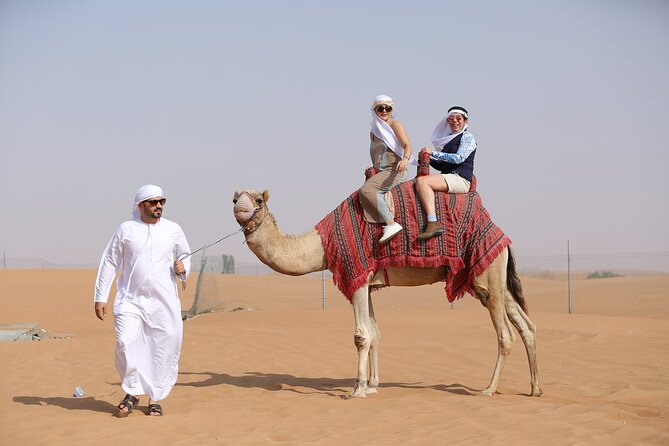 Dubai Desert Safari with Quad Bike, Dune Bashing, Camel Ride, Sand Boarding &BBQ - Quad biking across the sand
