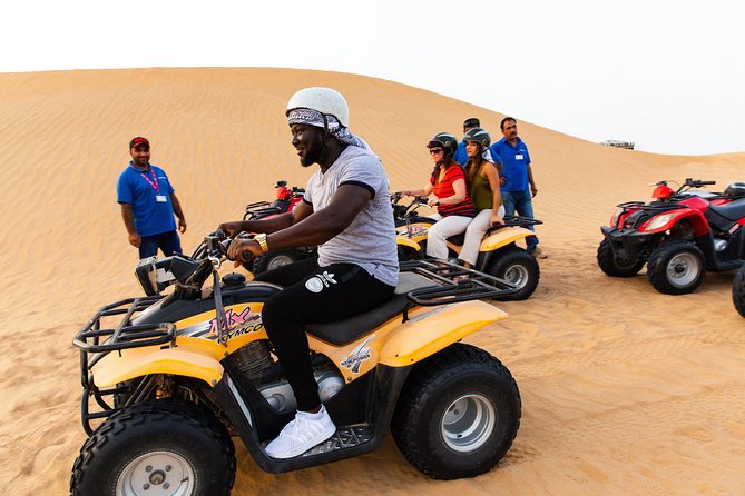 Dubai Desert Safari with Quads, BBQ Dinner, Camel ride, & Shows - Quad biking for ages 13 and up