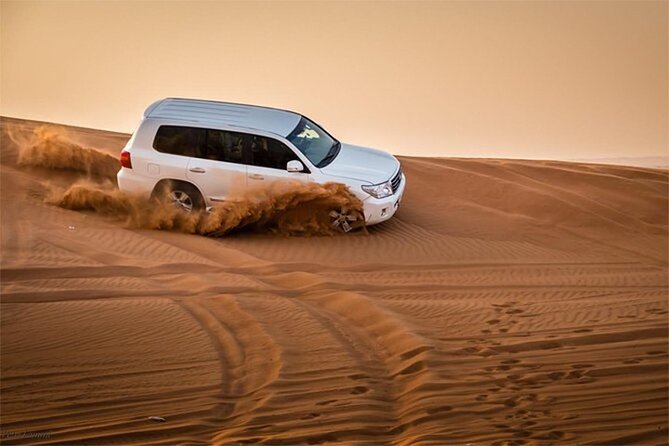 Dubai Desert Safari with Self Drive Quad Biking & Camel Riding - Sunset marks the shift from adventure to camp