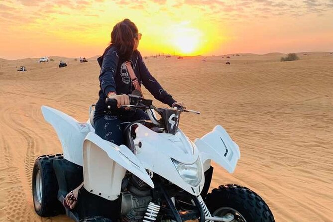 Dubai Dunes Safari With Quad Bike, Camel Ride, BBQ Dinner & Live Shows - Sandboarding adds a simple burst of fun