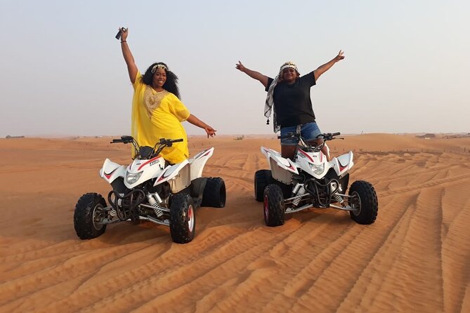 Dubai Dunes Safari With Quad Bike, Camel Ride, BBQ Dinner & Live Shows - Belly dance, tanura, and fire performances