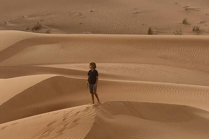 Dubai Elite Red Dunes Safari With Sunset & Bedouin Camp - Sandboarding and the highest sunset stop