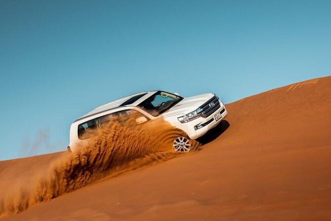 Dubai Evening Desert Safari & BBQ Dinner - Sandboarding and sunset on the sand