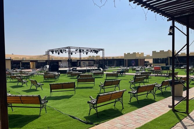 Dubai Evening Desert Safari With Transfers Dune Bashing & Dinner - Ninety minutes of music, dance, and fire
