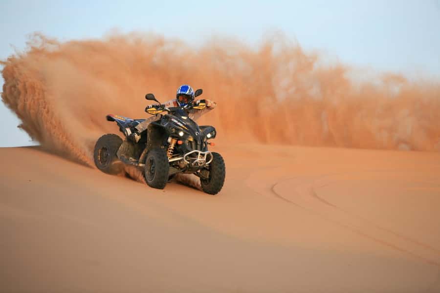 Dubai: Evening Tour with Quad Biking, Camel Ride, and BBQ - Leaving the city for Lahbab’s red dunes