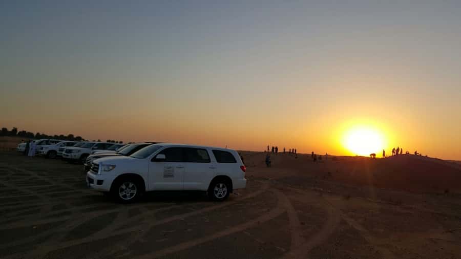 Dubai: Evening Tour with Quad Biking, Camel Ride, and BBQ - Sunset over the Lahbab dunes