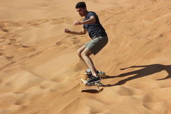 Dubai: Extreme Red Dune Buggy Desert Safari Adventure - Sandboarding from the highest dune