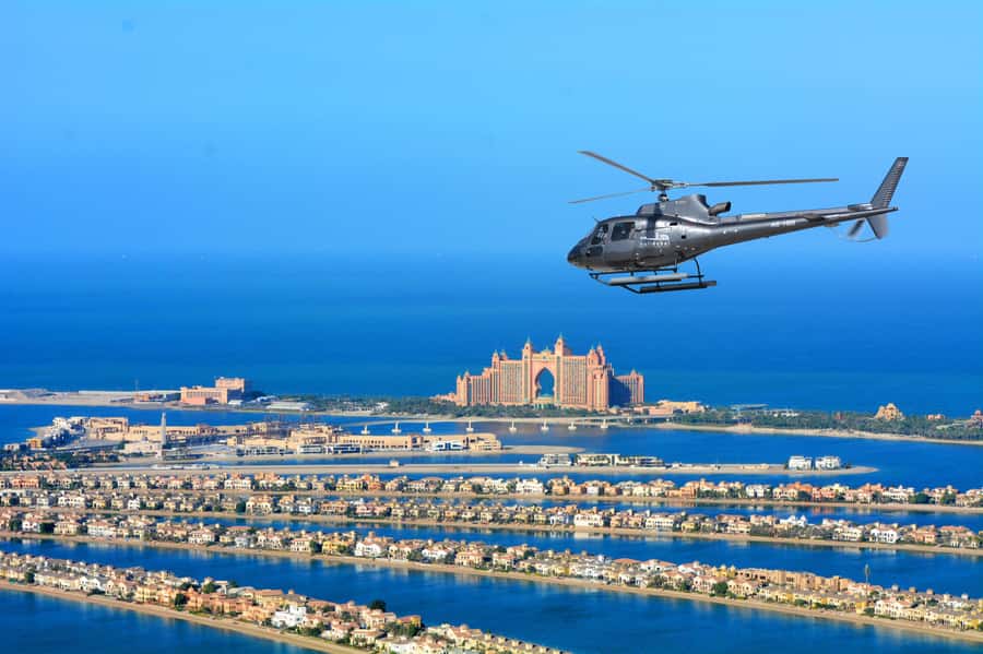Dubai: Helicopter Ride, Desert Safari, Camels & Refreshments - From Dubai hotels to the red dunes of Lahbab