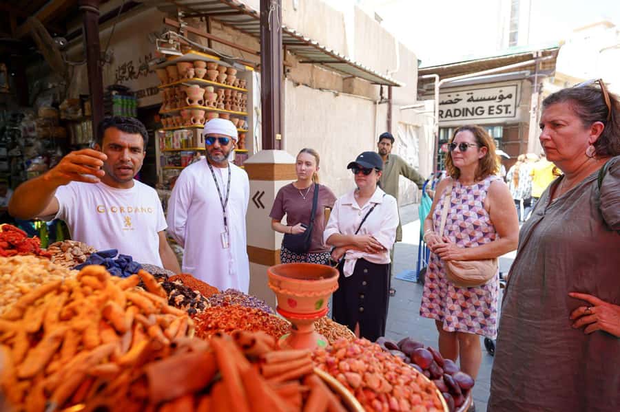 Dubai: Helicopter Ride, Old Town Walking Tour, Abra & Snacks - How the pickup and transfers affect the day