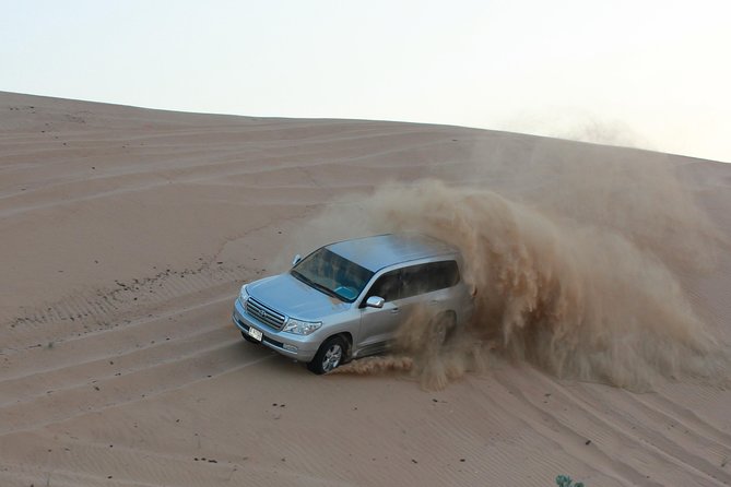 Dubai High Red Dunes Extreme Desert Safari Adventure with BBQ Dinner - Belly dancing, tanoura, and the fire show