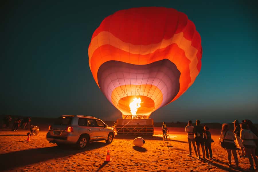 Dubai: Hot Air Balloon, Desert Safari, and Quad Biking Tour - A falcon show with a desert view