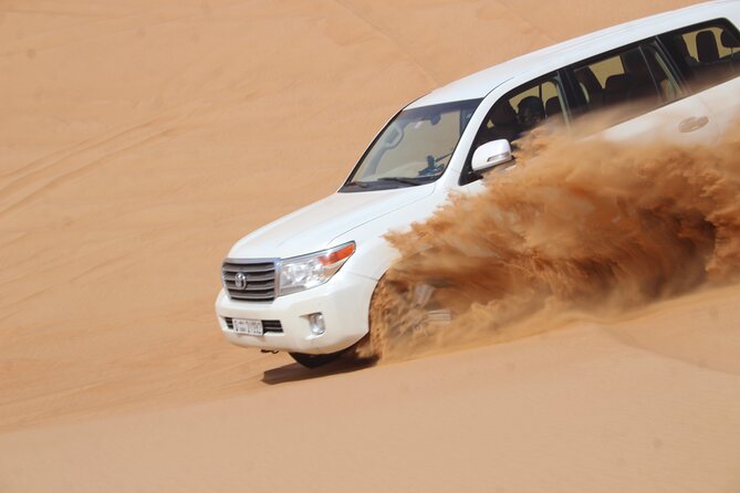 Dubai: Jeep Desert Safari, Camel Ride, and Quad Bike Tour - Sandboarding with time for photographs