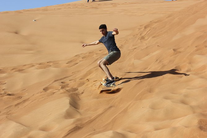 Dubai: Jeep Desert Safari, Camel Ride, and Quad Bike Tour - Al Aweer Camp, BBQ, and evening entertainment