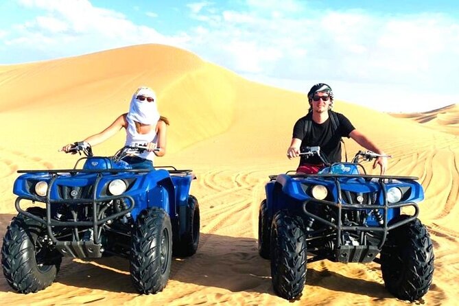 Dubai Long Self-Drive Quadbike with Camel and Falcon - Handling the quadbike in the red dunes