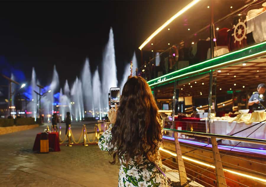 Dubai: Luxury Canal Dinner Cruise with Optional Transfers - The waterfall bridge and Dubai’s illuminated skyline