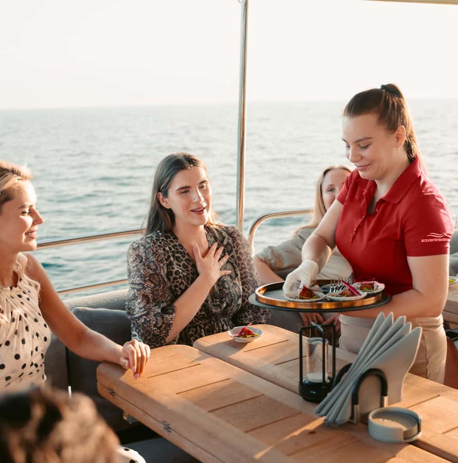 Dubai Marina: Luxury Yacht Tour with Breakfast or BBQ Option - Guide, crew, and the social mood