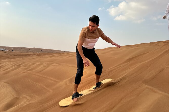 Dubai Morning 4 Seater Buggy Tour Sand Boarding & Camel ride - Sandboarding is simple, quick, and worth trying