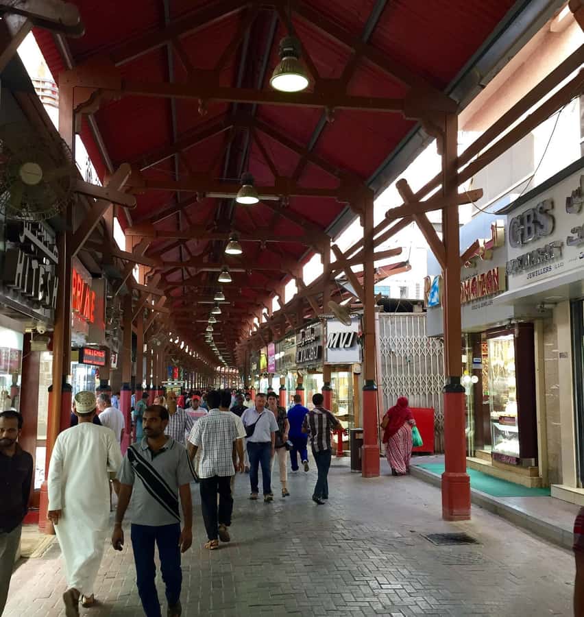 Dubai: Old City Walking Tour with Abra Ride - The Old Textile Market and the walk toward the Creek