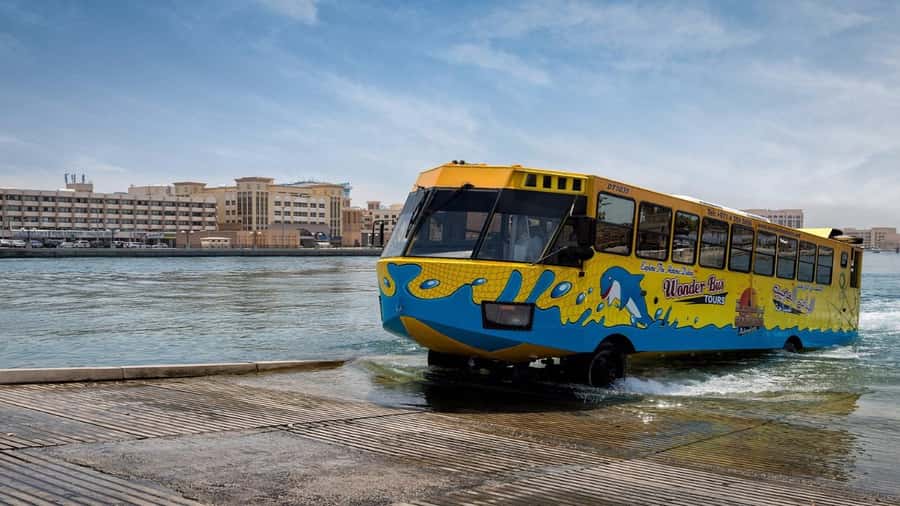 Dubai: Old town tour with Wonder Bus, souks, Creek and Guide - Textile Market, Heritage Village, and old waterfront sights
