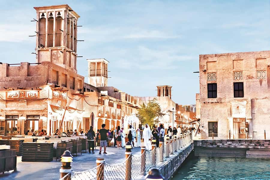 Dubai: Old Town Walking Tour with Abra Cruise & Street Food - Gold Souk displays and useful shopping advice