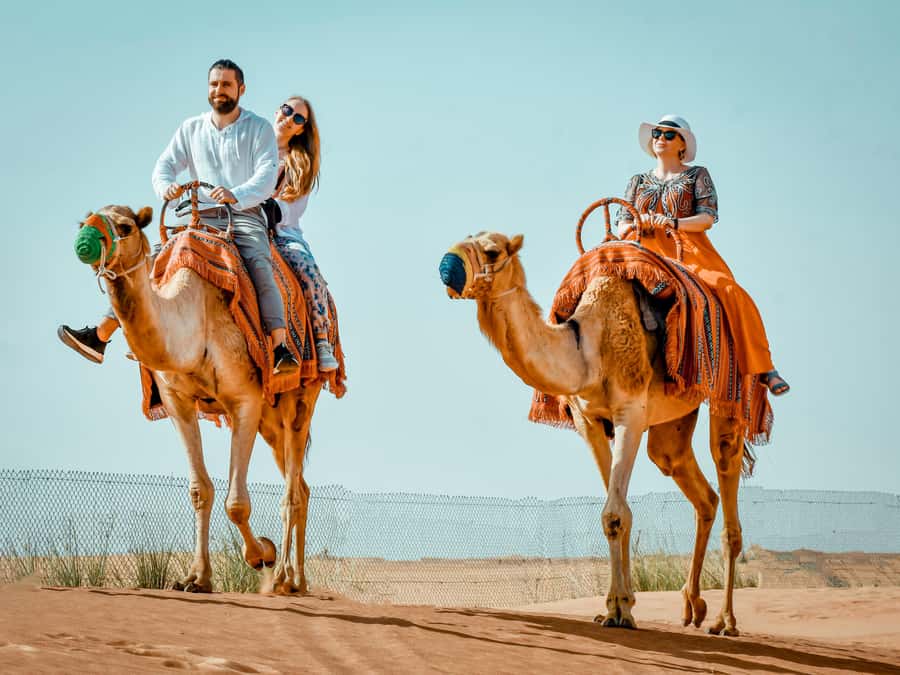 Dubai: Premium Red Dune Safari with Sandboarding & BBQ - Sandboarding, photos, and a short camel ride