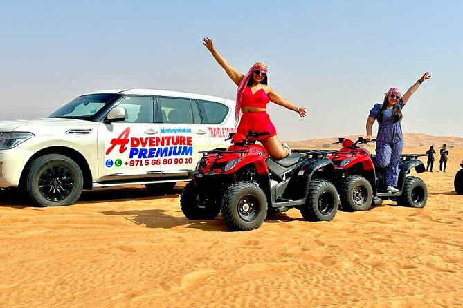 Dubai Premium Red Dunes, Quad Bike, Camel Ride, Sand Surfing & 5<em> BBQ – Key points to know before booking’ /></p>
<ul>
<li><strong>Red dunes near Lahbab:</strong> Drive about 45 to 60 minutes from Dubai for a more colorful desert setting than the city’s nearby sand areas.</li>
<li><strong>Dune bashing lasts 30 to 45 minutes:</strong> Expect a fast 4×4 ride over the dunes, followed by a photo stop of about 10 to 15 minutes.</li>
<li><strong>Quad bikes are guided:</strong> An experienced guide leads the ATV ride, so you are not simply sent into the desert alone.</li>
<li><strong>A full evening camp program:</strong> Camel rides, sandboarding, henna, shisha, falcon photos, tea, coffee, dates, sweets, dinner, music, and shows are all part of the plan.</li>
<li><strong>Dinner includes vegetarian food:</strong> The BBQ buffet offers both vegetarian and non-vegetarian choices.</li>
<li><strong>The main weakness is organization:</strong> A maximum group size of 150 can mean queues and idle time, while several bookings have suffered from late or missed pickups.</li>
</ul>
<h2 id="red-dunes-and-a-long-afternoon-in-lahbab">Red dunes and a long afternoon in Lahbab</h2>
<p><img width="669" height="446" decoding="async" src=
