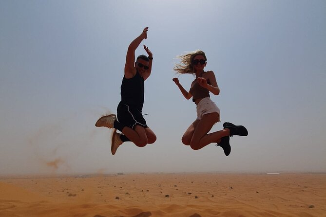 Dubai Premium Red Dunes Safari Camel Ride and BBQ Dinner - Belly dancing, Tanoura, and the fire show