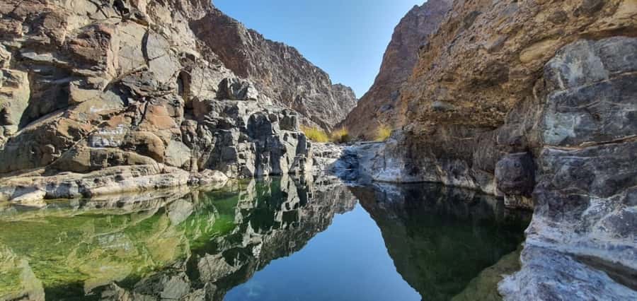 Dubai: Private Desert Day Tour and Wadi Shawka Pool Visit - Sandboarding and dune bashing provide the action