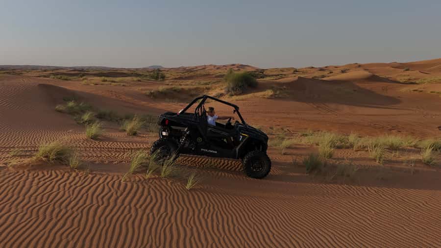 Dubai: Private Dune Buggy, Camel Ride, and Sand Boarding! - Sandboarding after the driver change
