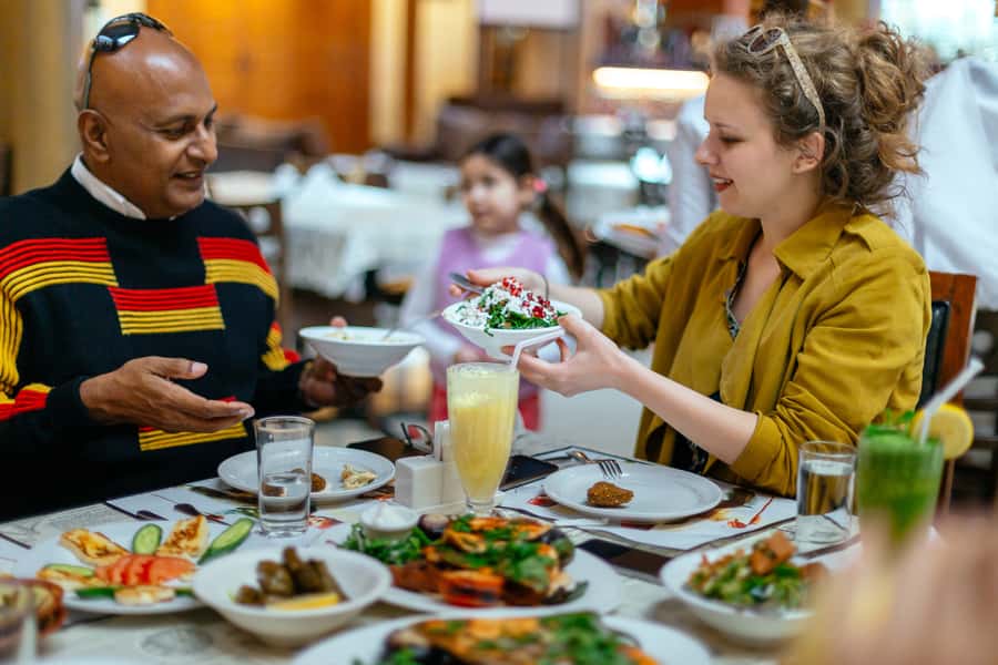 Dubai: Private Food Tour – 10 Tastings with Locals - Ten tastings, from familiar dates to camel burger
