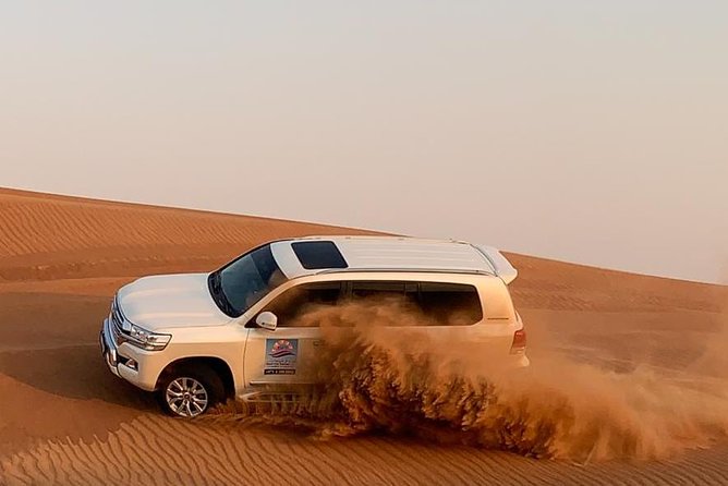 Dubai Private Morning Desert Safari: Camel Ride & Sandboarding - Dune bashing in a 4x4 Land Cruiser