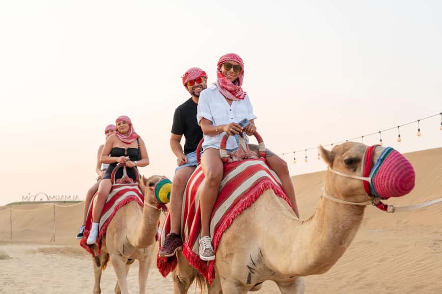 Dubai: Red Dune Desert Safari, Quad Bike, Camels, and BBQ - Leaving Dubai for the red dunes