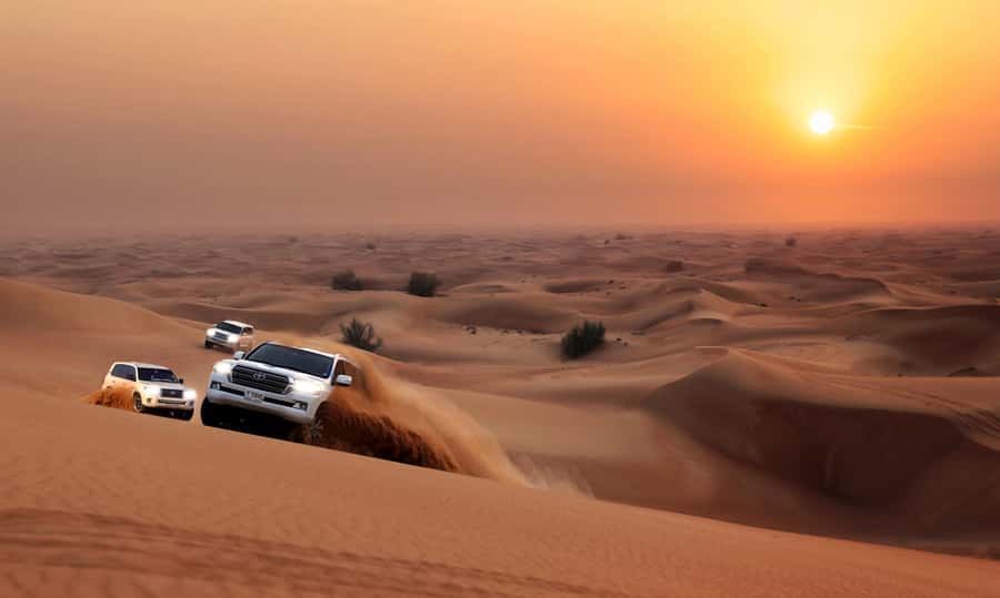 Dubai: Red Dune Desert Safari, Quad Bike, Camels, and BBQ - Camel rides and sunset photographs