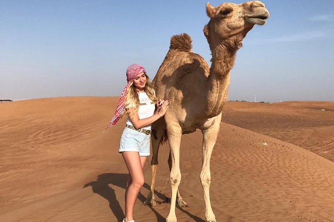 Dubai Red Dunes Desert Safari,ATV Quad Bike Camel Ride&BBQ Dinner - Camel ride, henna, shisha, and local dress