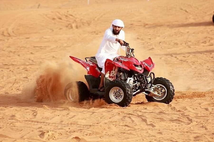Dubai: Red Dunes Evening Quad Bike, Dune Blast with BBQ - Dune bashing, sandboarding, and the sunset stop