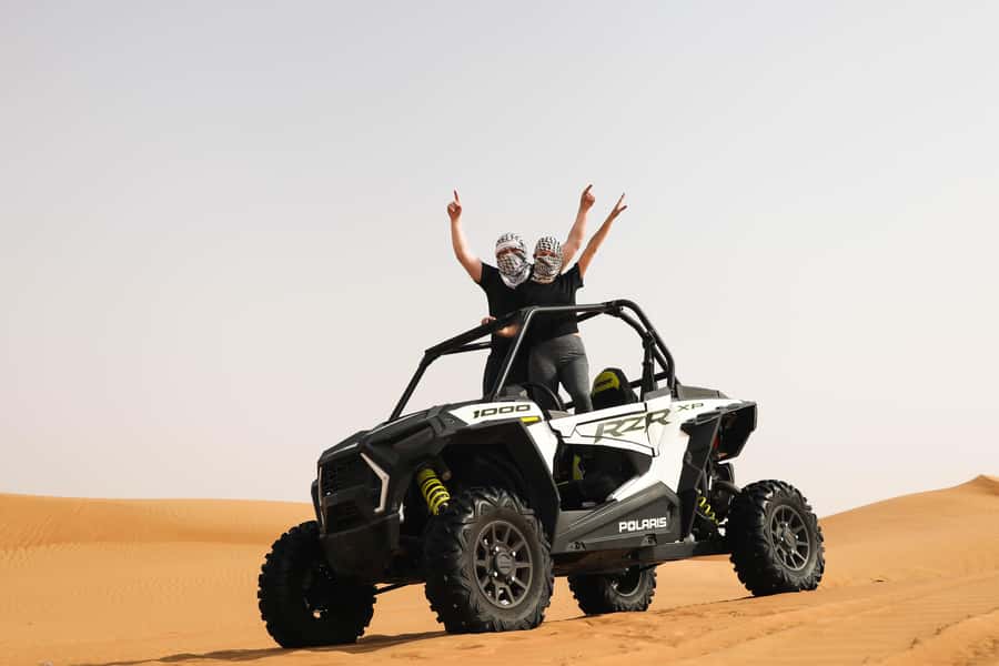 Dubai: Red Dunes Quad Bike, Dune Buggy, Camel & Refreshments - Sandboarding at the Midway Stop