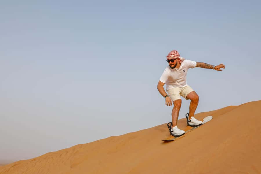 Dubai: Red Dunes Quad Bike with Sandboarding, Camels and BBQ - Welcome refreshments before the action