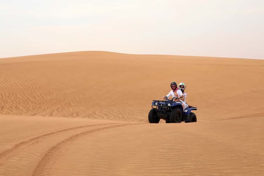 Dubai: Red Dunes Quad Bike with Sandboarding, Camels and BBQ - Sandboarding and the best photo stops