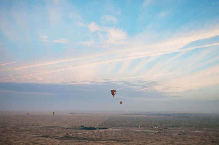 Dubai: Sunrise Hot Air Balloon Tour Over the Desert - Landing, certificates, and the trip back to Dubai