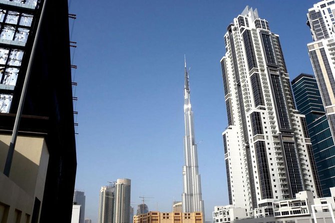 Dubai Tour and Desert Safari: Sand Boarding & BBQ Dinner Combo - Camel riding, henna, and camp activities