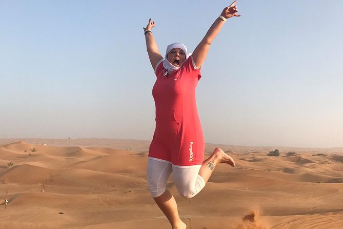 Dubai: Unique SUNSET 4WD Red Dunes Safari - A desert camp dinner with food and shows