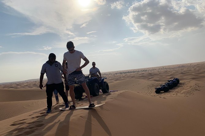 Dubai: Unique SUNSET Quad Bike Red Dunes Safari - A short camel ride for a slower desert view