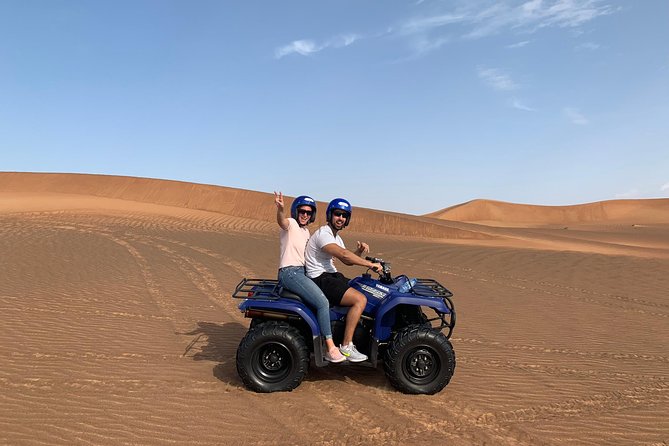 Dubai: Unique SUNSET Quad Bike Red Dunes Safari - BBQ dinner and the evening desert camp