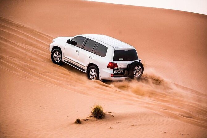 Dubia 4x4 Dune Bashing, Sandboarding, Camel Riding and Bbq Dinner - What happens at the desert camp