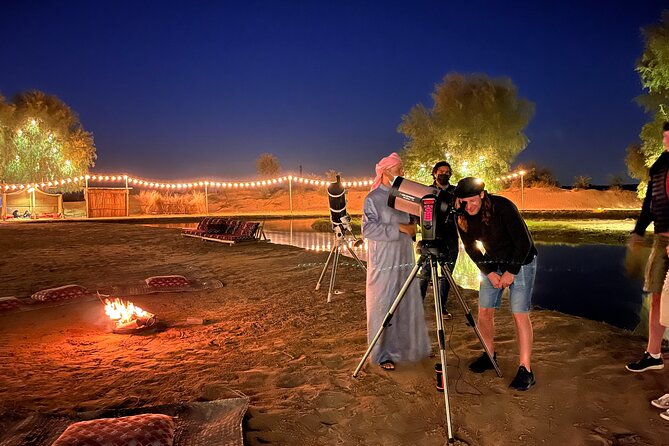 Evening Camel Caravan, Bedouin Dinner with Al Marmoom Oasis - Sunset, cooking stations, and small cultural moments