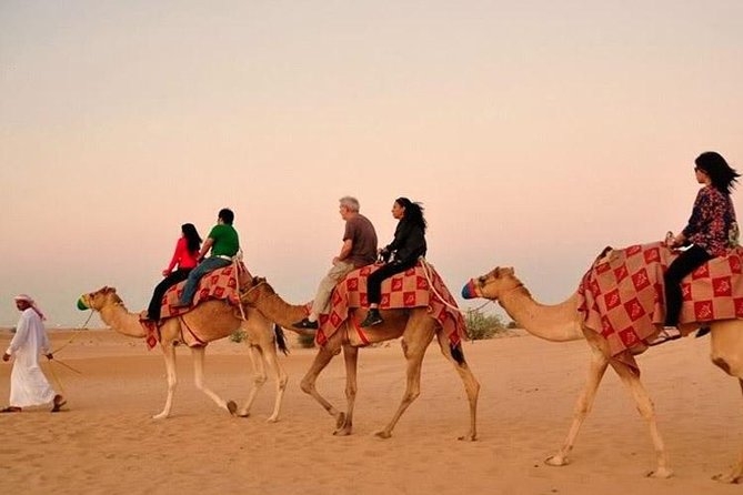 Evening Desert Adventure: Quad Biking, Sandboarding & Camel Ride - Quad biking across the red sand